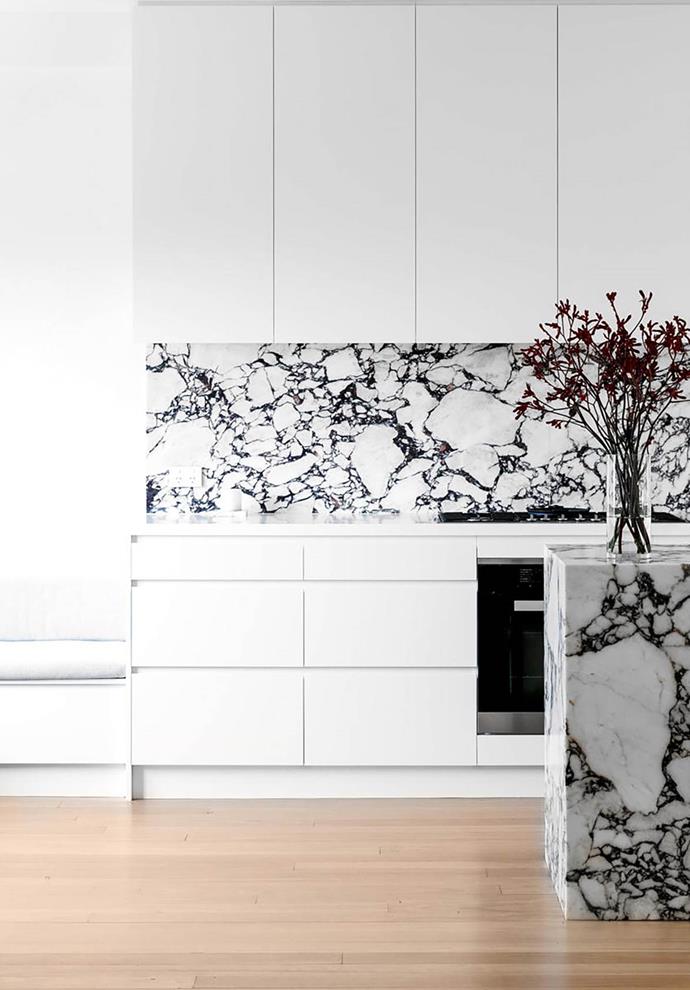 A luxurious 'plinth' of marble is the centrepiece of this timeless, simple and sophisticated kitchen. The owners "wanted a modern, fresh, inviting and timeless design," says Chris Ruffe, director of Bondi Kitchens who revamped the space in collaboration with The Interior Collective.