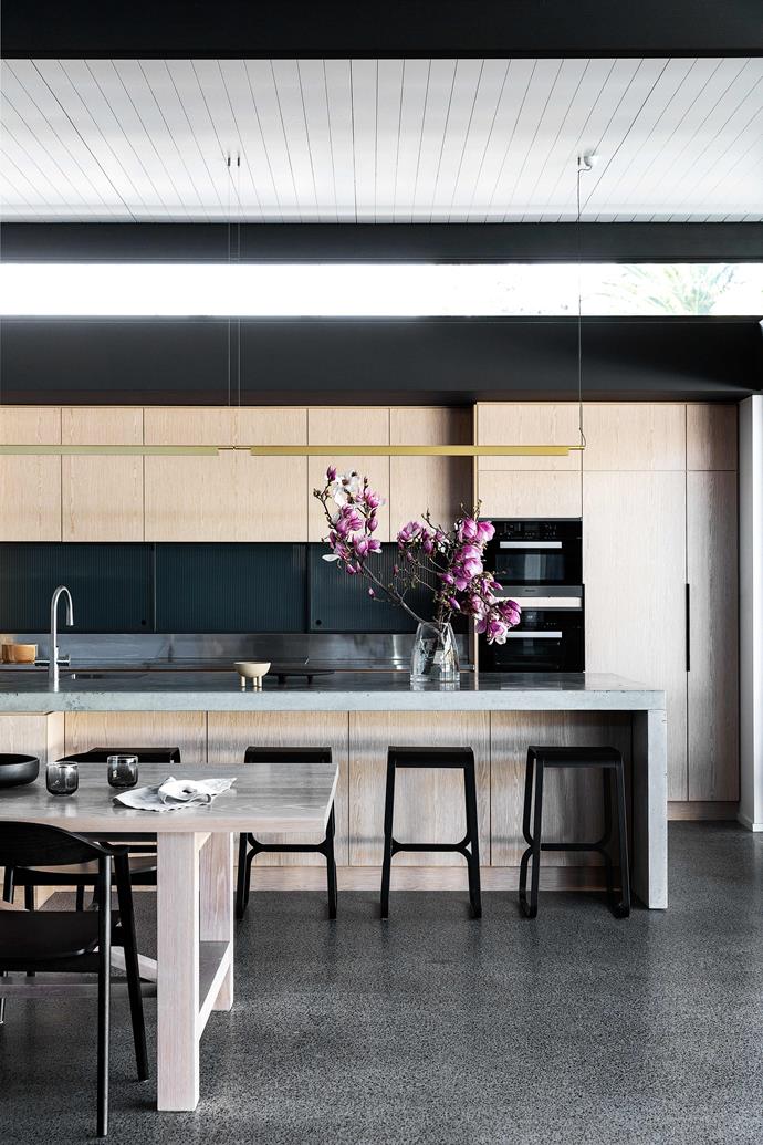 The sleek and contemporary industrial [Scandi-style update of this 1930s family home](https://www.homestolove.com.au/1930s-home-scandi-minimal-renovation-22978|target="_blank") saw the addition of a pavilion extension, which encompassed its open-plan kitchen and dining area. Hugely expansive, this zone is an entertainer's dream.