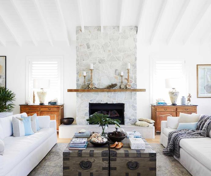 The stacked stone of the fireplace extends all the way to the all-white exposed rafter ceiling – another of Deborah's must-haves.