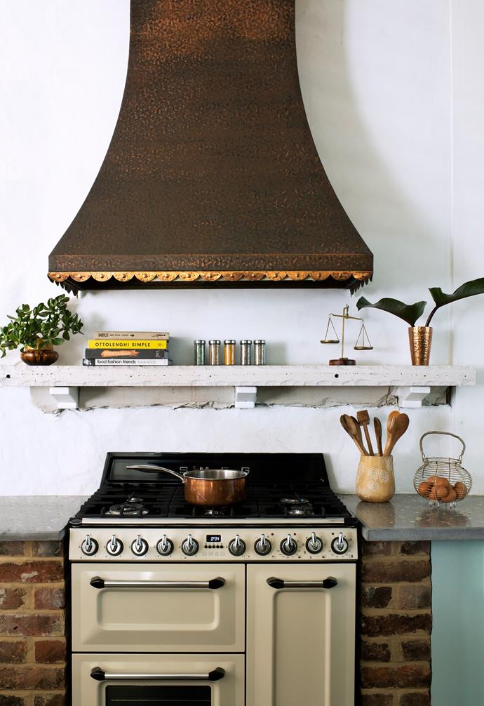 The Smeg stove is paired with a copper exhaust found on Gumtree.