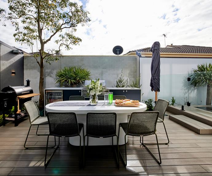 With a seamless transition between indoor and outdoor spaces, large glass sliding doors opening directly onto a large [deck](https://www.outdure.com/|target="_blank"|rel="nofollow") with 8 seat oval [concrete dining table](https://www.globewest.com.au/collection/ossa-outdoor/ossa-concrete-oval-dining-table|target="_blank"|rel="nofollow") and outdoor BBQ kitchenette.