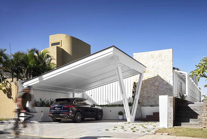 Harry paid homage to the home's 1950s origins by designing a carport with V-shaped detailing combined with stone walling and crazy paving.