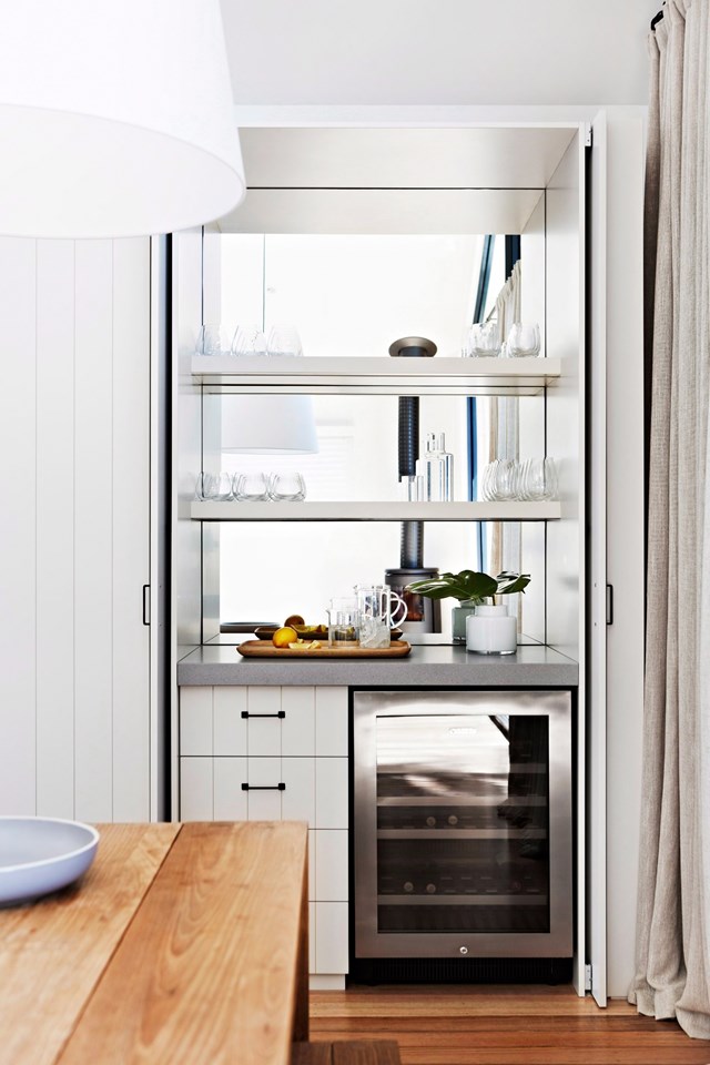 An integrated wine fridge is cleverly positioned nearby your entertainer's kitchen to allow guests to help themselves.