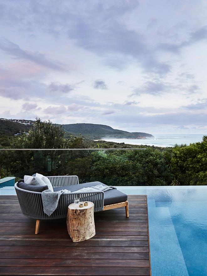 Perched at the water's edge, this NSW Central Coast home's swimming pool enjoys dress-circle vistas of the ocean.