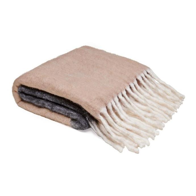 **[Cookie bumble blanket, $139, Castle and Things](https://www.castleandthings.com.au/collections/throws/products/beige-black-bumble-blanket|target="_blank"|rel="nofollow")**<br>
Crafted from a soft mohair wool blend, this neutral two-toned blanket is generously-sized and features beautiful long tassles.