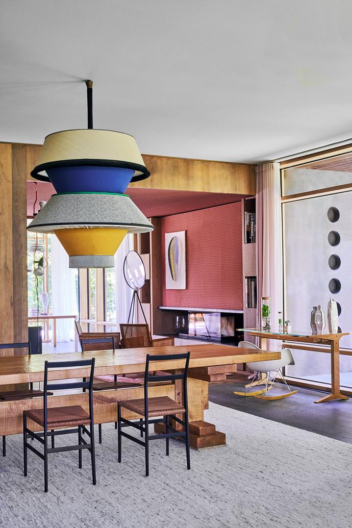 Decorated with sculptural lighting and furniture, the [living room](https://www.homestolove.com.au/lounge-room-ideas-21182|target="_blank") is one of the most visually engaging spaces in architect Valentina Moretti's home. A Guiseppe Rivadossi table and Superleggera chairs by Gio Ponti for Cassina are framed by a Tisca 'Sindar-KA' rug and Valentina's custom lamp, created with Arch. Artwork on the wall by Velasco Vitali.