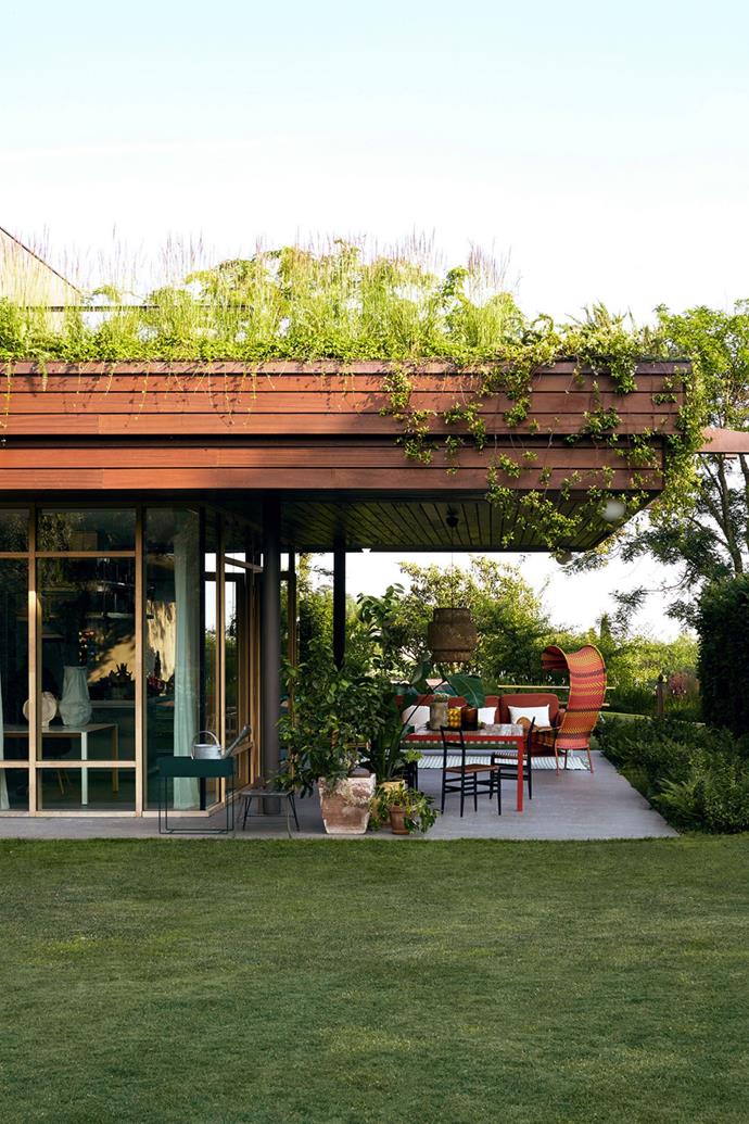 [Landscaping](https://www.homestolove.com.au/how-to-landscape-your-backyard-3742|target="_blank") was carefully considered throughout the build, with foliage and hedges selected to create natural privacy screening for both the alfresco living area and around the full-length windows. While the overhanging roof shelters the porch, it's also fitted with planter boxes that contain different types of foliage and creeping plants to ensure the structure blends back into its vineyard locale.