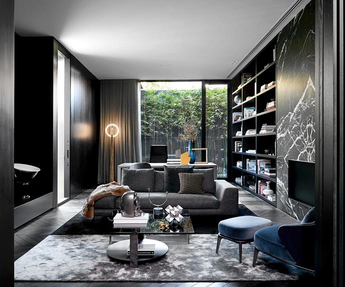 The [formal living room](https://www.homestolove.com.au/formal-living-rooms-20549|target="_blank") is adjacent to the formal dining room at the front of the house off the gallery. Minotti 'Leslie' armchair sourced in London. Elementary Abacus standing sculpture by Marta Figueiredo. In the background can be seen two Minotti Freeman 'Tailor' sofas with a 'Ritter' coffee table and 'Dibbets' rug, all sourced from Minotti in London and available locally through De De Ce.