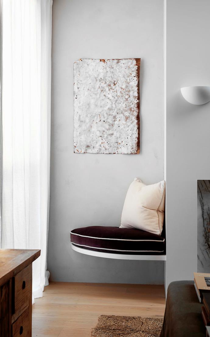 A cosy custom-made corner seat is framed by an Isadora Vaughan artwork from Station Gallery.