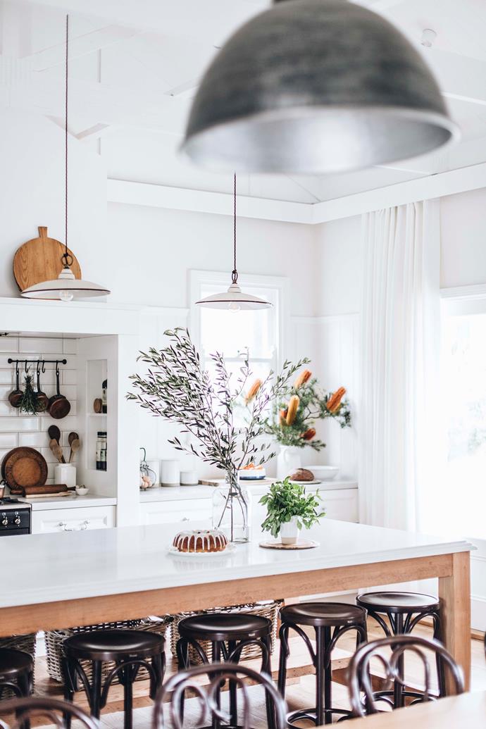 At [Sinclairs of Berry](https://www.homestolove.com.au/sinclairs-of-berry-nsw-farmstay-23113|target="_blank"), a recently renovated guesthouse in the NSW Southern Highlands, a large kitchen island is the hero of the room. To highlight the hand-cut stone benchtop and make the island the ultimate prep space, a pair of dainty [Italian ceramic pendants from Lighting Collective](https://lightingcollective.com.au/products/antique-ceramic-pendant-light-made-in-italy|target="_blank"|rel="nofollow") were installed directly above the work surface.