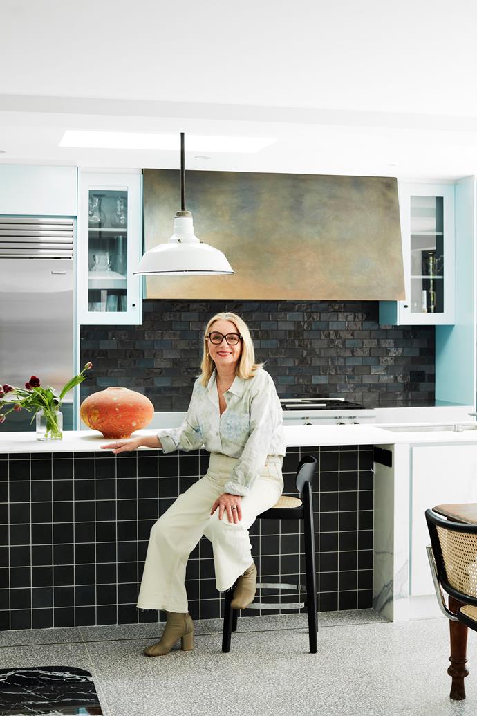 Homeowner and interior designer, Julie Manfredi Hughes in her hardworking and beautiful kitchen. Thonet counter stool, Anibou.