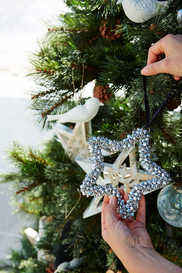 When [styling your Christmas tree](https://www.homestolove.com.au/christmas-tree-decorating-tips-2611|target="_blank"), keep the hero ornaments for feature positions, usually front and centre at eye level, but don't forget to keep them evenly spaced, too.