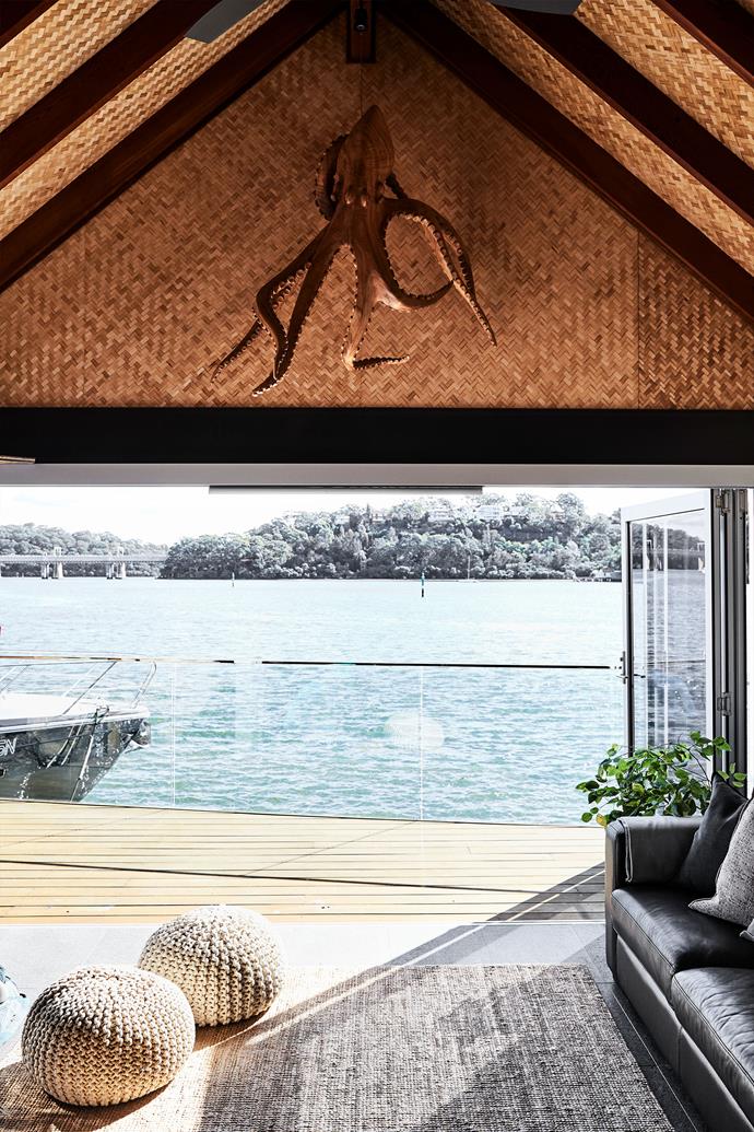 Woven bamboo panels from House of Bamboo line the roof of the boatshed.