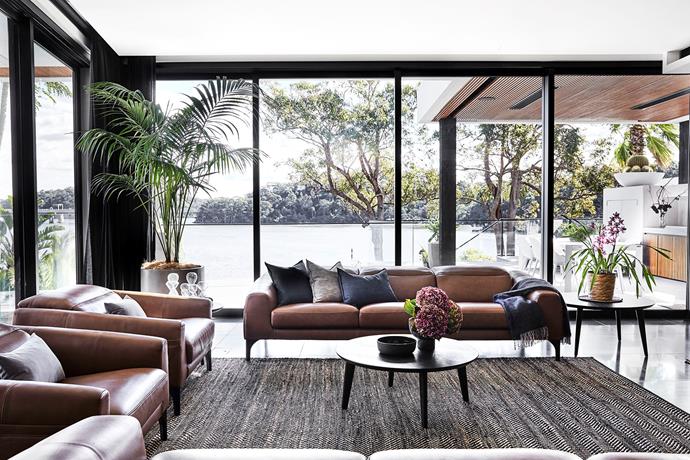The living room was designed around the view and is styled with a 'Venus' coffee table and Reo sofa and armchairs from King Living. The 'Serengeti' rug is from Armadillo.
