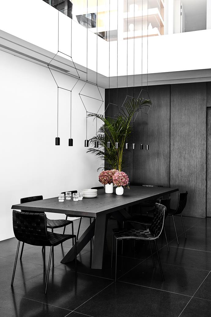 The dining room features a Bonaldo 'Big' dining table from Fanuli, Milano dining chairs from Coco Republic, and a Vibia 'Wireflow Lineal' pendant light from Koda Lighting.