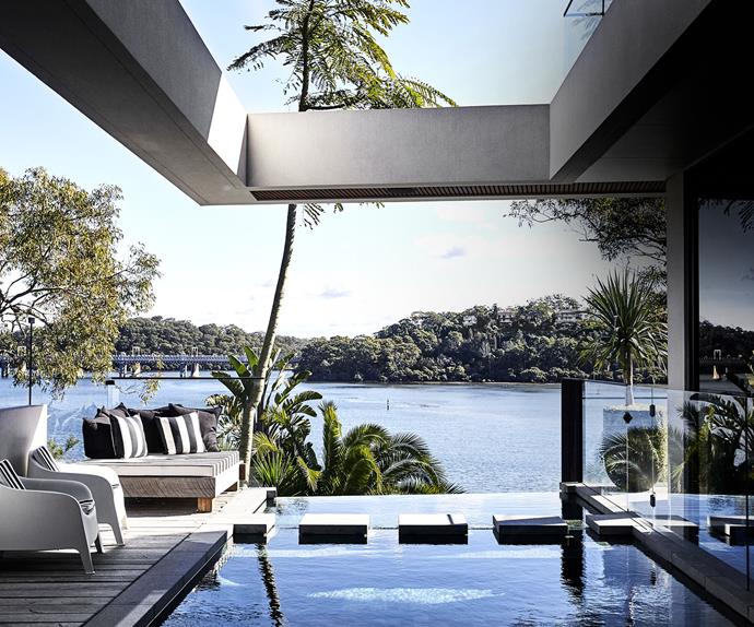 pool alfresco dining area with water view