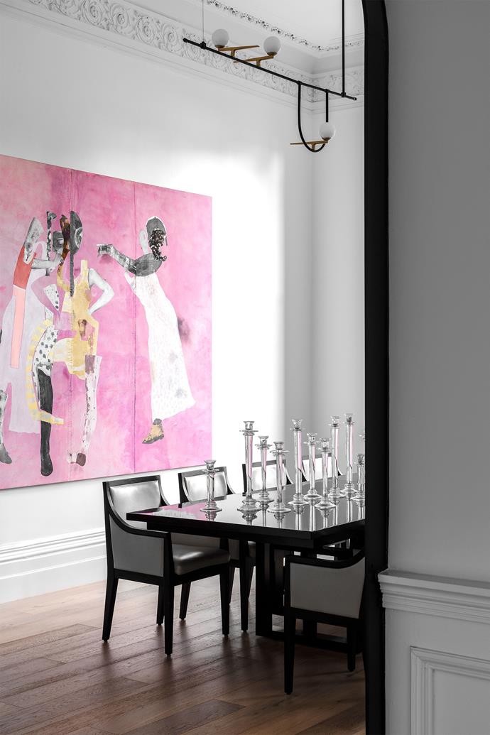 Fox Sisters by Sally Smart hangs in the formal dining room. "The art has a big effect on this room. It makes it feel alive and contemporises the space," says the owner. "The pink Sally Smart has a gentleness and elegant beauty that suits the room." Chairs from Meizai surround a table from Cromwell. Candelabras from Market Imports.