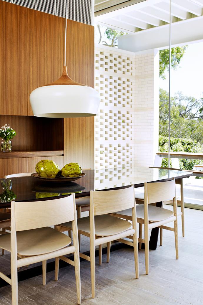 The [mid-century influence](https://www.homestolove.com.au/understated-mid-century-family-home-22385|target="_blank") comes across in the dining room, with a Concorde table by Emmanuel Gallina from Poliform, Porro 'Neve' dining chairs by Piero Lissoni from Space, and a Coco Flip pendant light from Workshopped.