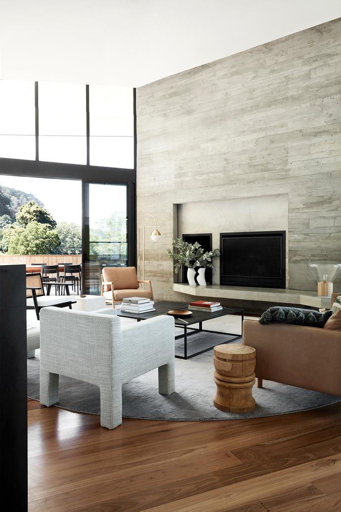 Planked off-form concrete surrounds the fire. Felix Chubby chair, Anja occasional chair, Sketch 'Nysse' occasional chair and Sketch 'Pensive' sofa, all from [GlobeWest](https://www.globewest.com.au/|target="_blank"|rel="nofollow").