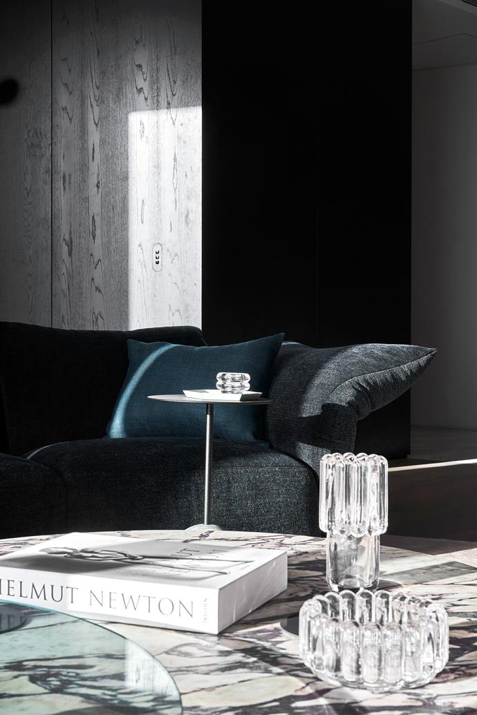 A sense of warmth is created with the Edra 'Standard' sofa by Francesco Binfaré from Space and 'Ivy' coffee table by Clare Cousins from Grazia & Co. Tom Dixon 'Press' glassware from Living Edge.