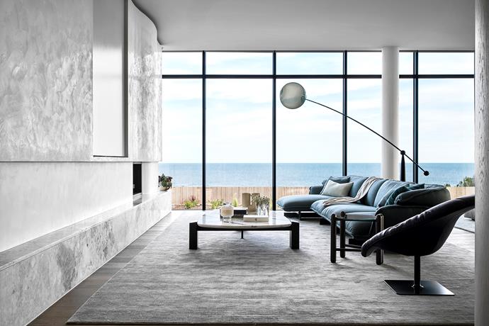 Under the 'Opal Arc' floor lamp by Tom Dixon from Living Edge, the Cassina '551 Super Beam' sofa system and Moroso 'Bohemian' armchair by Patricia Urquiola from Hub offer a comfortable perch in the living room. 'Ontario' rug from The Rug Establishment.