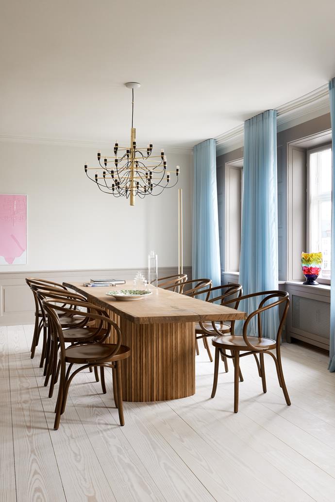 A bespoke solid oak dining table by Force Majeure takes centre stage in the dining room, accompanied by Thonet walnut chairs from [Beau Marché](https://beaumarche.dk/|target="_blank"|rel="nofollow"). Above is a [Flos chandelier](https://www.flos.com/|target="_blank"|rel="nofollow"). On the wall is Memory by [Andrés Reisinger](https://reisinger.studio/|target="_blank"|rel="nofollow") and a Big Collina Extra Color vase by [Gaetano Pesce](http://www.gaetanopesce.com/|target="_blank"|rel="nofollow") stands on the windowsill.