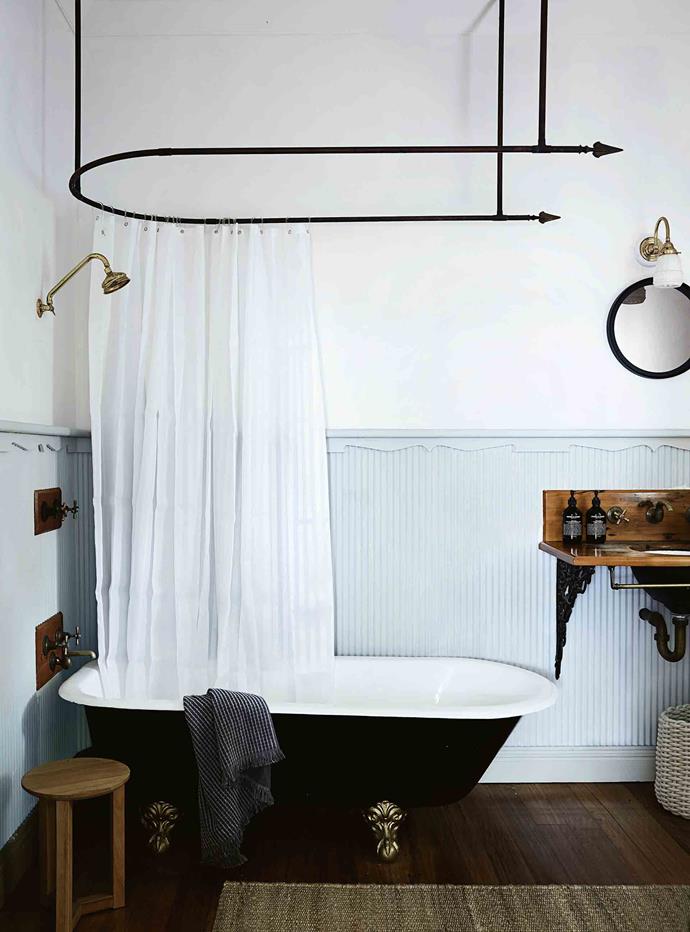 For something a bit different, the antique shower curtain rod in [this country holiday house](https://www.homestolove.com.au/aura-tracie-ellis-home-12138|target="_blank") beautifully mirrors the curving bathtub below. 