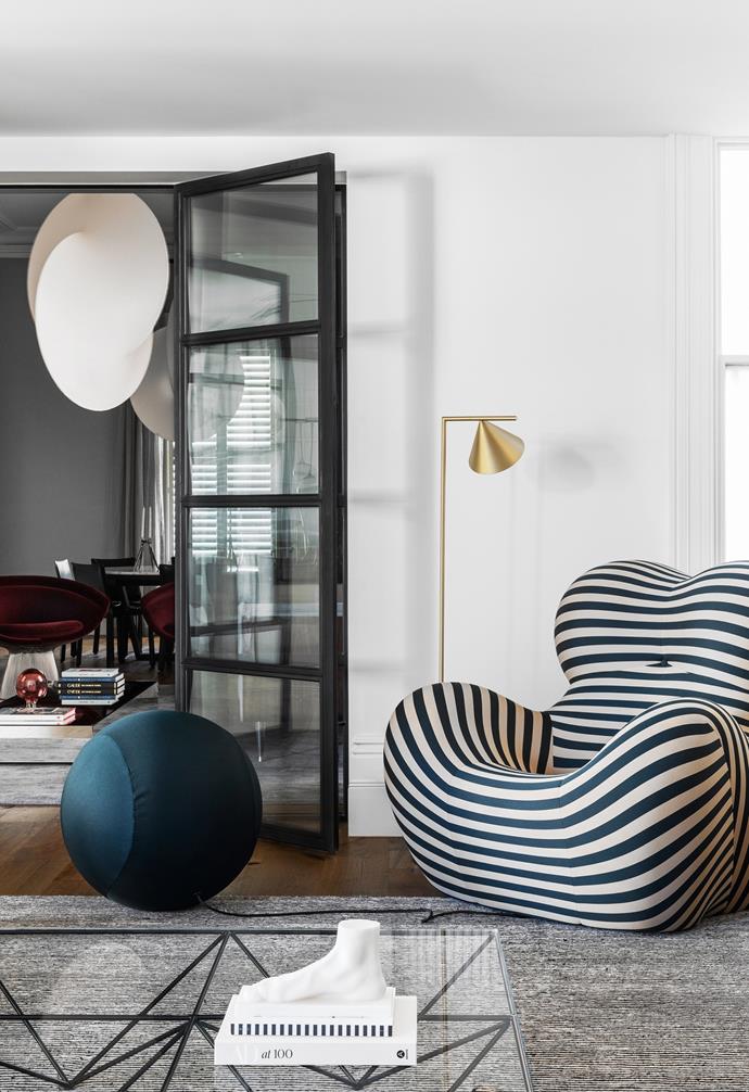 Curves aren't just for the building [but the furniture too](https://www.homestolove.com.au/curved-furniture-trend-2019-19737|target="_blank"). The voluptuous B&B Italia 'Up Series 2000' armchair and ottoman by Gaetano Pesce in [this revived Victorian terrace](https://www.homestolove.com.au/revived-victorian-terrace-melbourne-23073|target="_blank") brings plenty of personality to the space. 