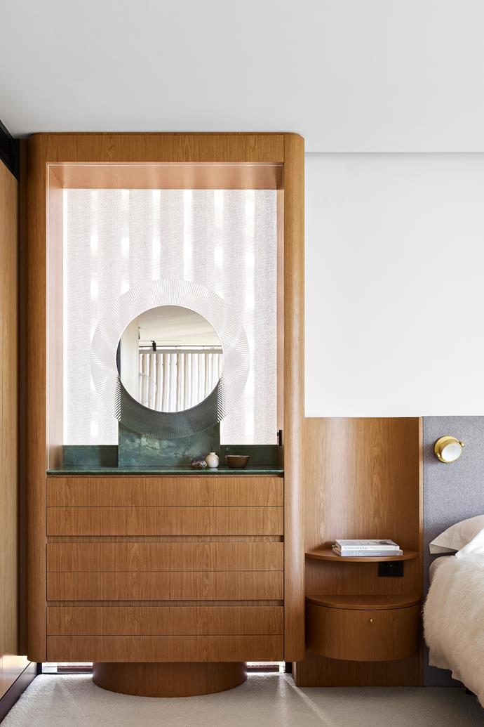 As you open the door to the master bedroom, a striking dresser cabinet featuring a Kartell 'All Saints' mirror from [Space](https://www.spacefurniture.com.au/|target="_blank"|rel="nofollow") and a polished Smeraldo stone top is the first thing you see.