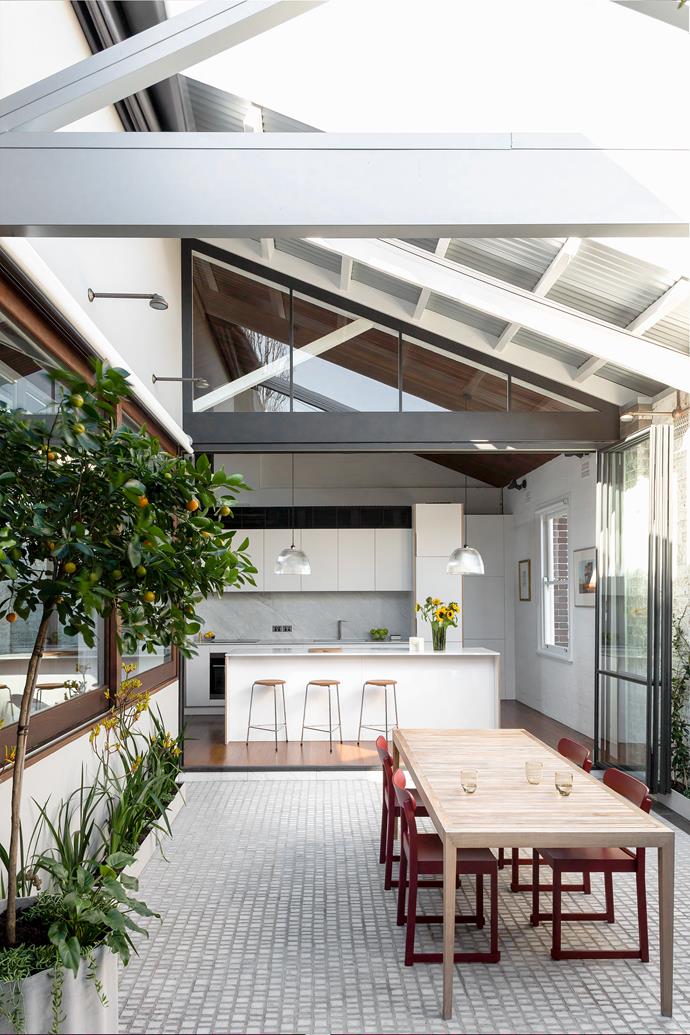 The beautiful roofline is fully visible here. At the kitchen counter are Fritz Hansen 'Dot' stools from [Cult](https://cultdesign.com.au/|target="_blank"|rel="nofollow"). The glass pendant lights were another exciting discovery, found boarded up (like the old sign) and refurbished.