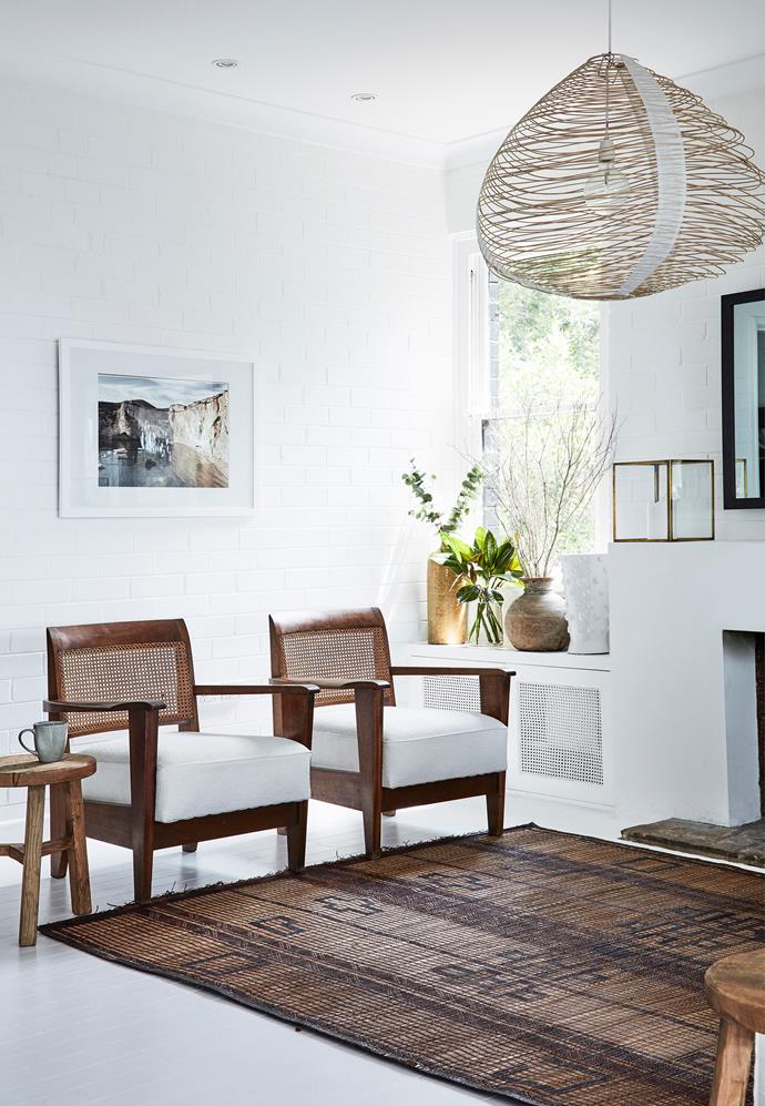 Mediterranean-meets-Australian coastal style in this [renovated holiday home](https://www.homestolove.com.au/rustic-coastal-style-home-19795|target="_blank"), where white concrete and painted brick provide the perfect canvas for interior designer Olivia Babarczy's collection of furniture and decor she has sourced from flea markets in Europe during her travels.