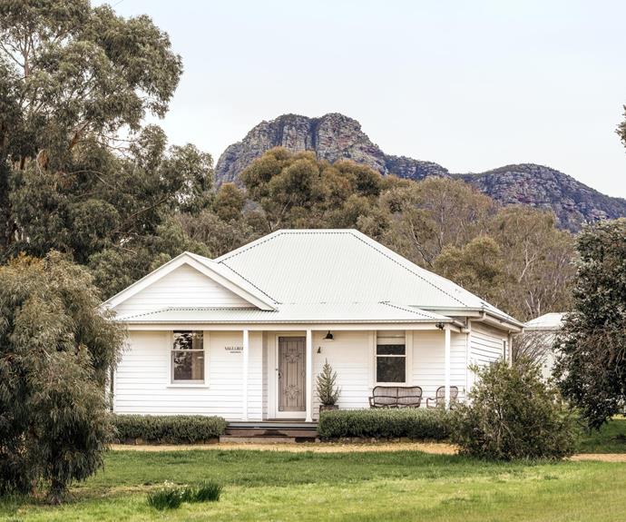 The weatherboard holiday home sits below Mt Sturgeon and Mt Abrupt.
