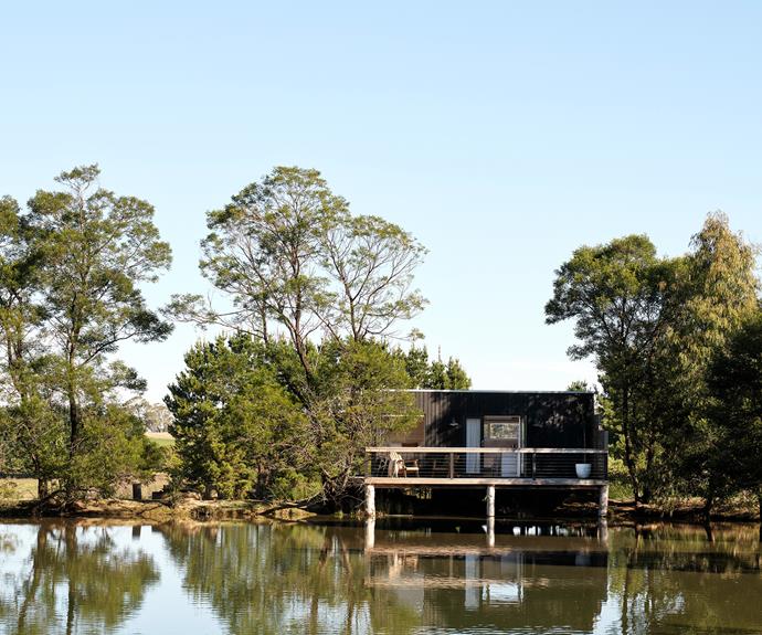 Extending out over one of the dams on the property, the Hideout 1.0 cabin offers guests a private and beautifully relaxed start to the day. Wake up cocooned within the cosy Baltic pine interior, which is dressed with bedding from [In The Sac](https://inthesac.com.au/|target="_blank"|rel="nofollow") and complemented by a dark-green cushion and wool blanket from [Jardan](https://www.jardan.com.au/|target="_blank"|rel="nofollow").