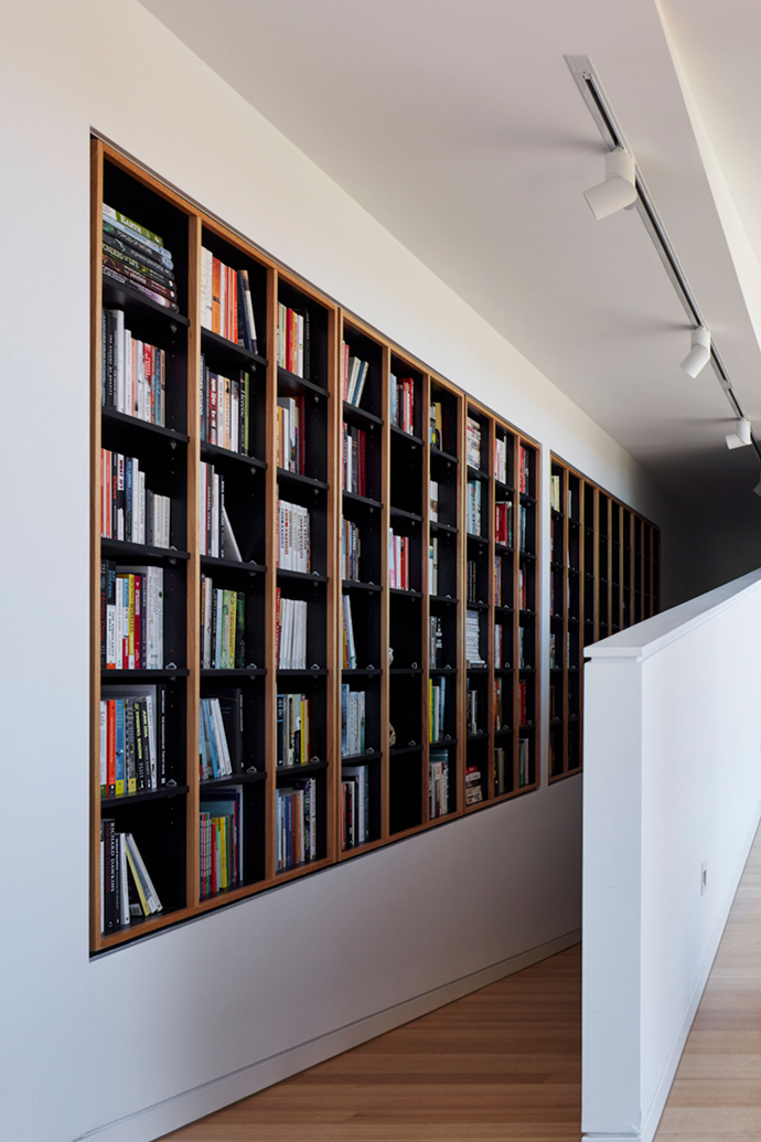 The impressive built-in library is housed next to one of the ramp designed to gives Audrey the Dachshund free rein of [this architect-designed home in Adelaide](https://www.homestolove.com.au/architect-designed-home-adelaide-7087|target="_blank").