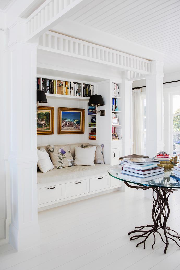 The much-prized reading spot in [this Hamptons inspired holiday home](https://www.homestolove.com.au/a-hamptons-inspired-holiday-home-south-of-perth-5122|target="_blank") in Perth is built into the library wall, encompassing the reader in a cosy nook. 