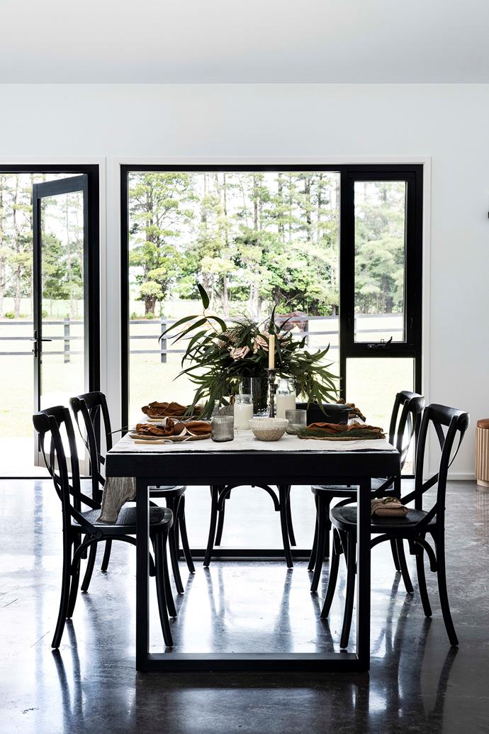 Homewares store owner and freelance creative [Hayley Priest's modern farmhouse](https://www.homestolove.com.au/modern-farmhouse-christmas-23227|target="_blank") dining room is simply styled, allowing the stunning rural views beyond the windows take centre stage. The table is by Coco Republic, while the chairs were sourced at Barbara's Storehouse in Bowral.