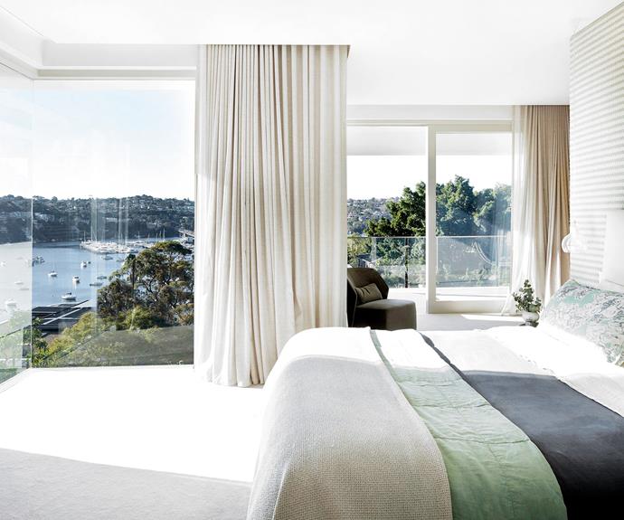 A wall in Osborne & Little 'Mouflon Twill' offsets the breathtaking water view. Society Limonta bedding from [Ondene](https://ondene.com/|target="_blank"|rel="nofollow") and an armchair from [Manyara Home](https://www.manyarahome.com.au/|target="_blank"|rel="nofollow") reference the colours of the trees and water while linen curtains from [Blind & Drape Store](http://www.blindanddrapestore.com.au/|target="_blank"|rel="nofollow") and Bremworth Collection 'Champs Elysees' carpet create a soothing backdrop.