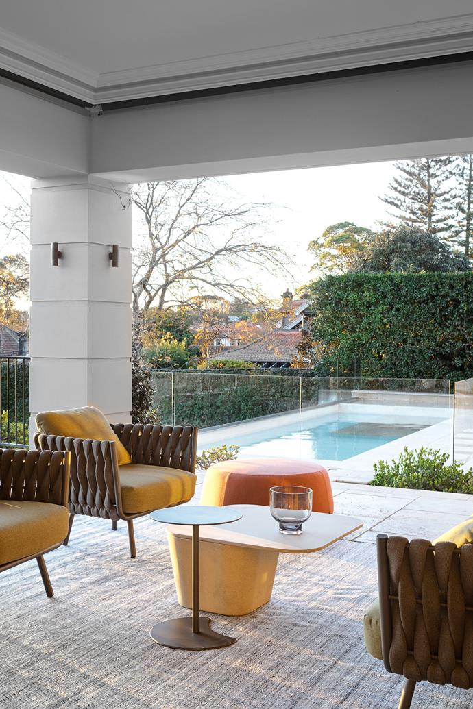 Overlooking a compact but well-used swimming pool, the west-facing terrace's Tribù 'Tosca' sofa and chairs from Cosh Living are a prime spot to take in the sunset.