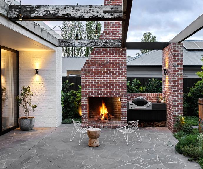 Locally sourced recycled bricks give the new Argentinian-style fireplace a vintage look.