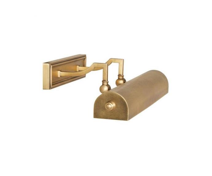 Create drama by placing the **[Library wall sconce in antique brass, $855, Coco Republic](https://www.cocorepublic.com.au/library-wall-sconce-antique-brass|target="_blank"|rel="nofollow")** above an artwork or sidetable.