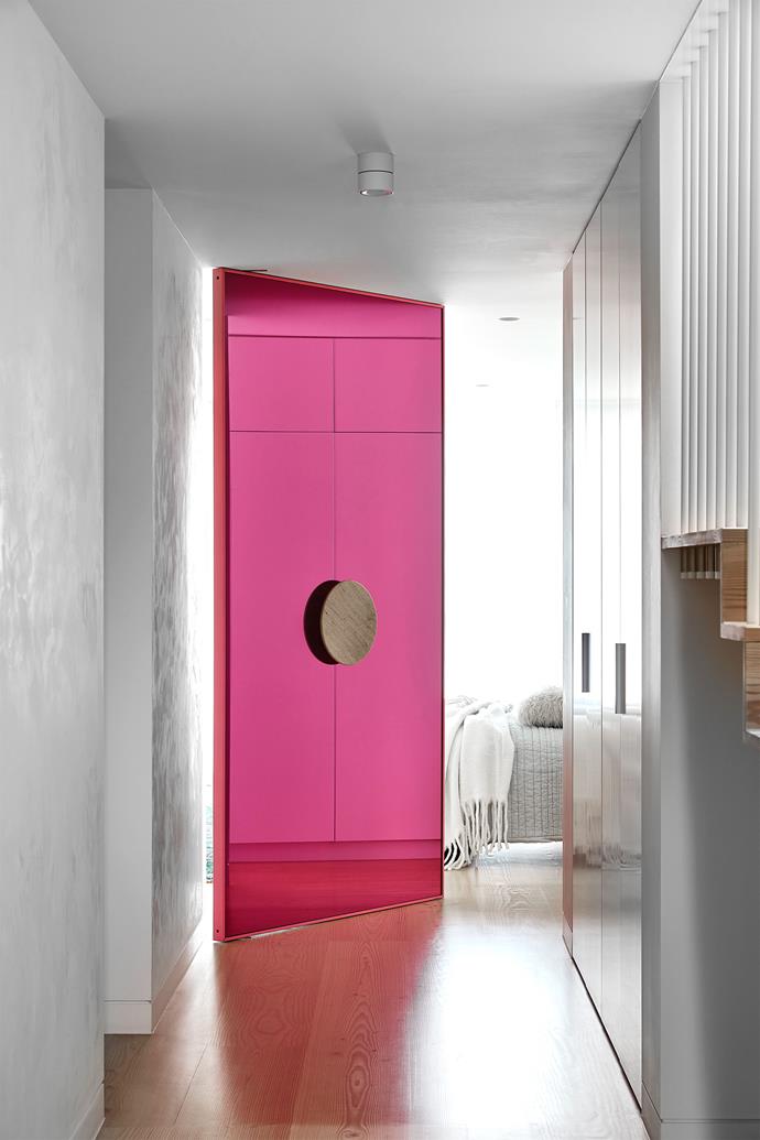 **Bedrooms:** A Schiaparelli-pink acrylic door pops at the entrance to the main bedroom of this newly extended Melbourne home. "The bold shot of colour juxtaposes with the serenity of the room beyond," says interior designer Mardi Doherty. <br> 
*Design by Doherty Design Studio; [dohertydesignstudio.com.au](https://www.dohertydesignstudio.com.au/|target="_blank"|rel="nofollow")*