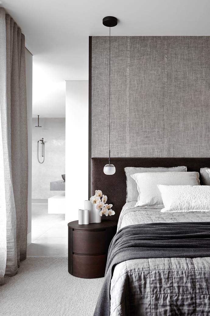 **Bedrooms:** The owners wanted sleeping quarters with muted tones and materials such as velvet to up the luxe factor and deliver textural depth. Privacy was created with full-height joinery behind the bed. "We then applied linen wallpaper, which inspired the rest of the textures in the room," says interior design Louise Walsh. <br> 
*Design by Louise Walsh Interior Design; [louisewalsh.com.au](https://www.louisewalsh.com.au/|target="_blank"|rel="nofollow")*