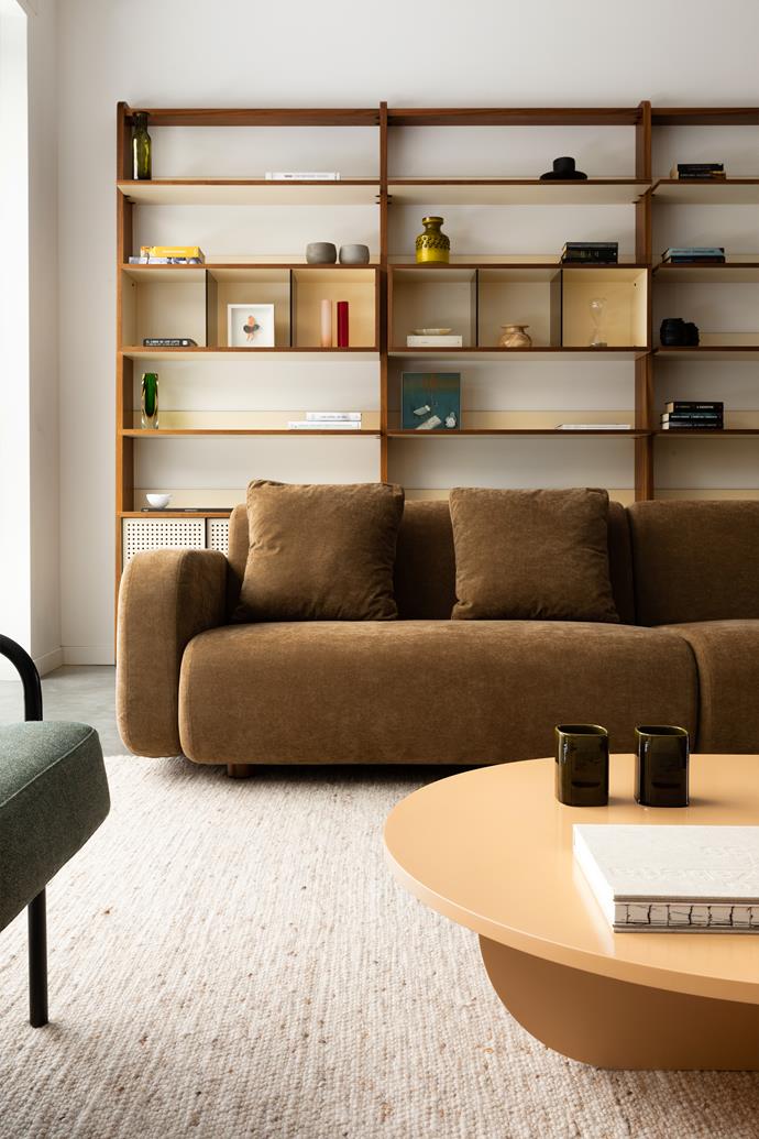 The custom bookshelf was designed to display mementos, not store books. Because regular access to the shelves wasn't required, Fabio decided to push the [Nube Italia](http://www.nubeitalia.it/en/|target="_blank"|rel="nofollow") sofa right back against it.