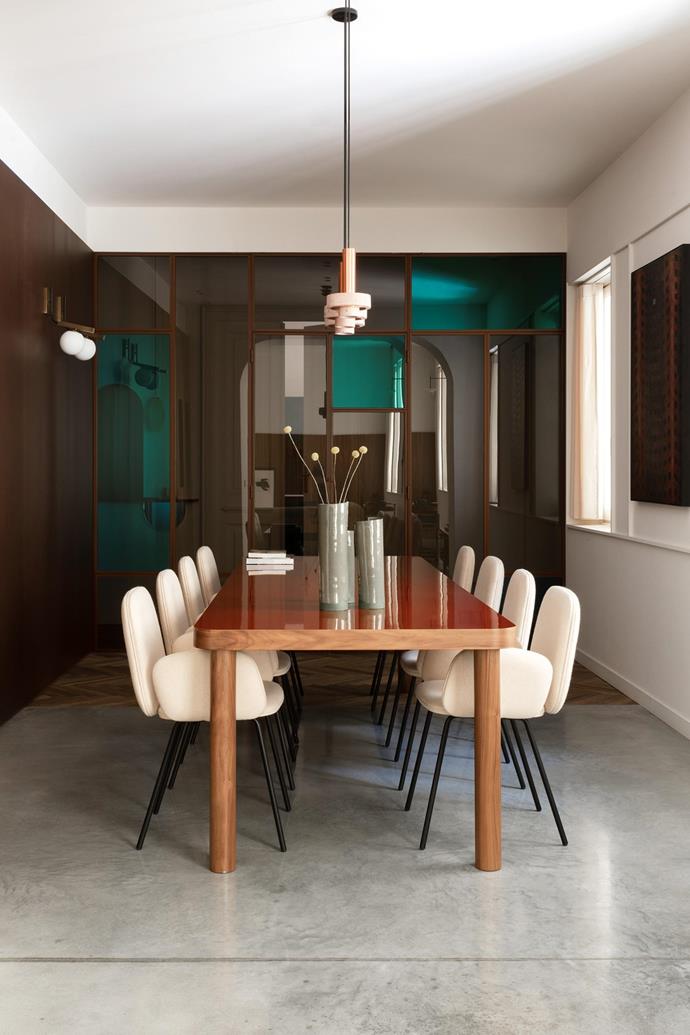 Such a long dining room could have felt austere, but the cream-coloured Leda chairs by [Miniform](https://www.miniforms.com/en/|target="_blank"|rel="nofollow") and curvy dining table that architect Fabio Fantolino designed for Thonet soften the space. The down lights, [David Pompa](https://www.davidpompa.com/|target="_blank"|rel="nofollow") pendant lamps and globe sconces by Claudia Melo for [UTU](https://www.utulamps.com/|target="_blank"|rel="nofollow") allow for varying degrees of illumination.