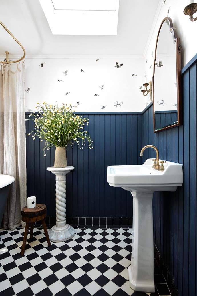In the bathroom is a deep enamelled cast-iron bath from France and the floor is laid in heritage black and white tiles.