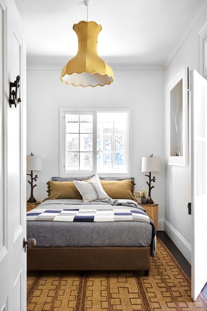 The master bedroom includes a sophisticated blend of vintage and contemporary pieces.