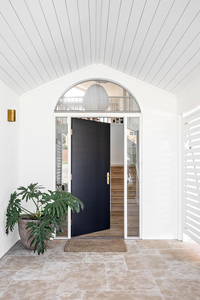 The charming front door gives away just a hint of the neutral-toned paradise to come.