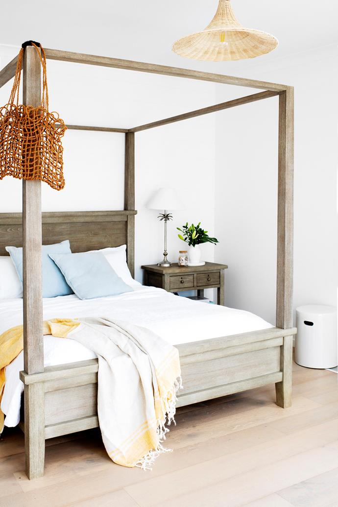 A 'Farmhouse' canopy bed from Pottery Barn sets the scene in the main bedroom.