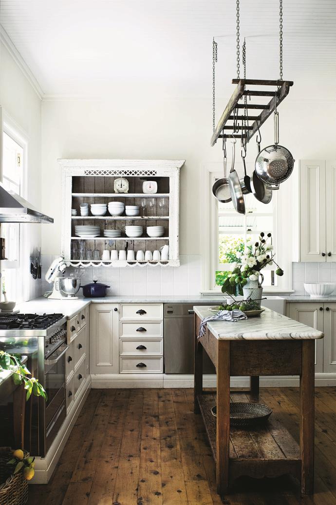 At [Willow Farm Homestead](https://www.homestolove.com.au/willow-farm-homestead-13727|target="_blank"), the French-provincial style kitchen is an entertainer's dream. The wall shelves were an upcycled find, and the freestanding island (where plenty of family treats have been baked over the years) is topped with dreamy marble. 