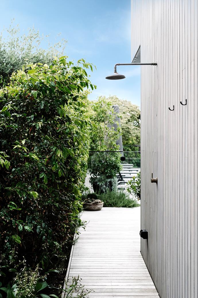 Fast-growing Waterhousea floribunda on the boundary has provided almost instant privacy for the home. The weatherproof Natura copper outdoor shower and silvertop ash decking and house cladding were all sourced through Bartlett Architectural Construction.